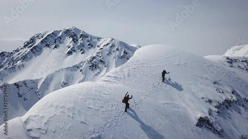 Climbers Walking Up Mountain Expedition Aerial Flight Epic Mountain Range Climb To Success Beautiful Peak Winter Vacation Exploration Adventure Hiking Tourism Concept. photo