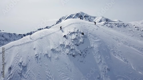 Climbers Walking Up Mountain Expedition Aerial Flight Epic Mountain Range Climb To Success Beautiful Peak Winter Vacation Exploration Adventure Hiking Tourism Concept. photo