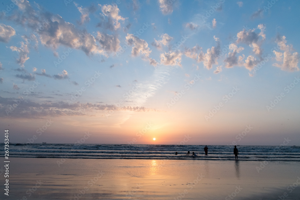 Silhouettes of people playing on Juhu beach Silhouettes of people playing on Juhu beach