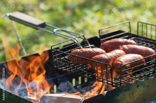 barbecue meat on the fire unopened. summer picnic in the country.