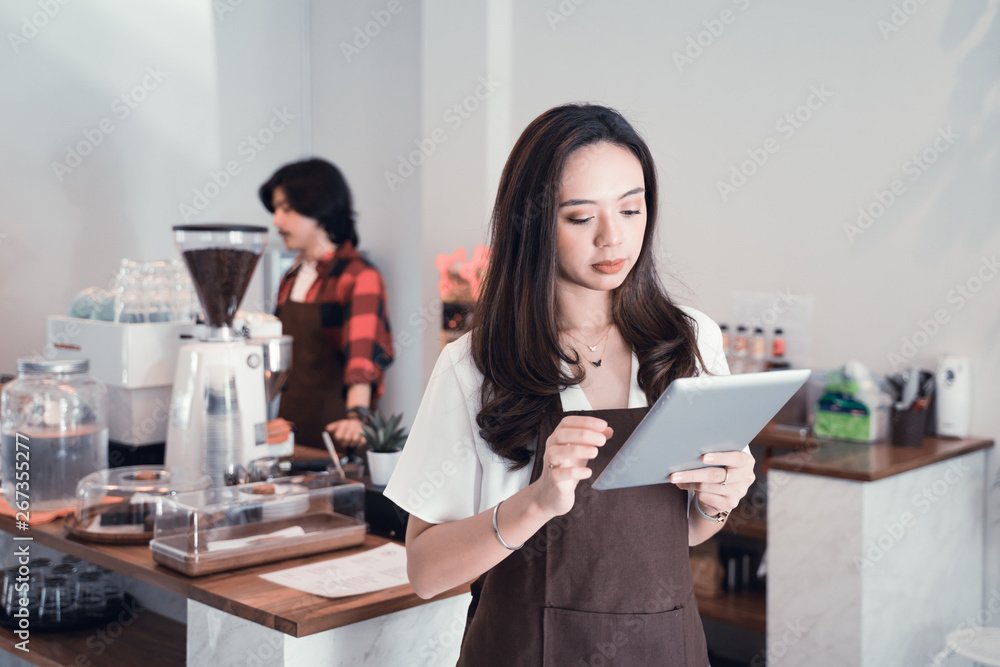 young asian cafe worker with tablet. business entrepreneur young asian cafe worker with tablet. business entrepreneur
