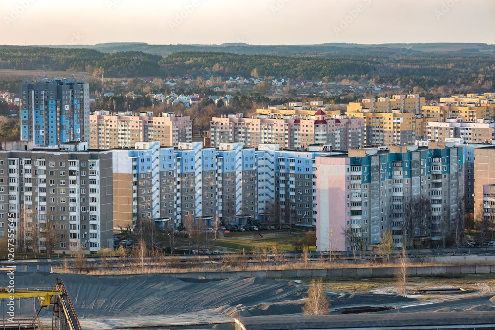 Fototapeta premium Panoramic view on new quarter high-rise building area urban development residential quarter in the evening from a bird's eye view