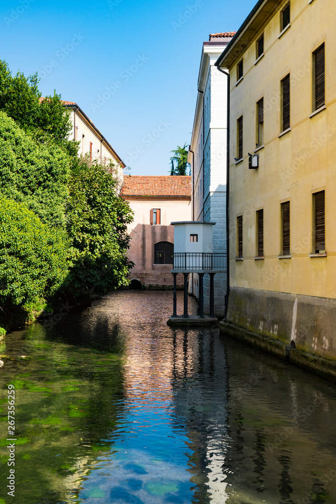 colorful houses along  canal, river Sile,  Treviso, Italy