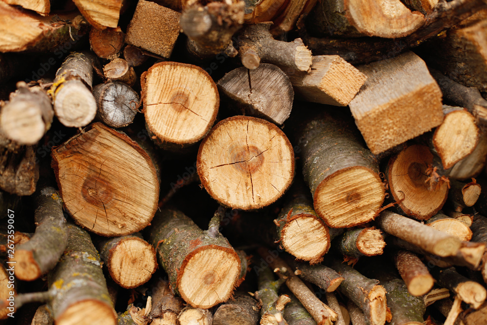 closeup wooden background - firewood for heating stove and fireplace closeup wooden background - firewood for heating stove and fireplace