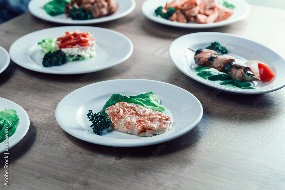 chicken fillet in cheese, and lettuce on the dining table