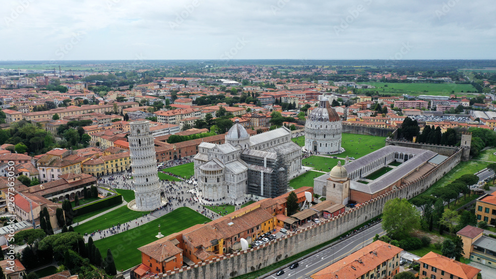 Aerial view of the Square of Miracles with Pisa’s Leaning Tower, Cathedral of Santa Maria Assunta and Baptistery in Pisa, Tuscany, Italy.