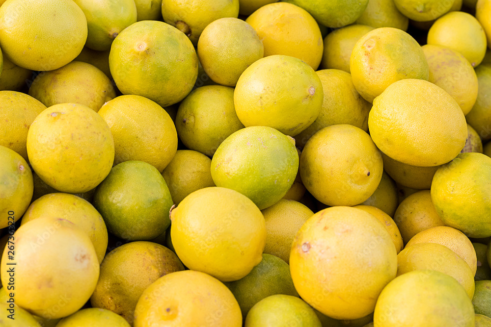 Fresh yellow lemons, close-up shot, agriculture and food concept, background