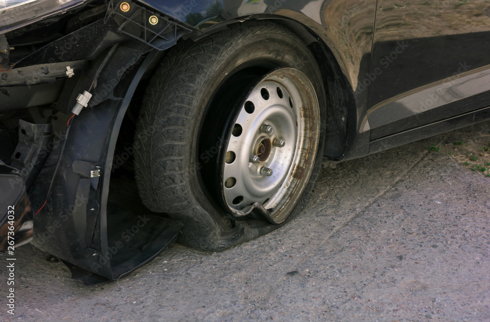 Accident on the road with damage to the car. knocked wheel.