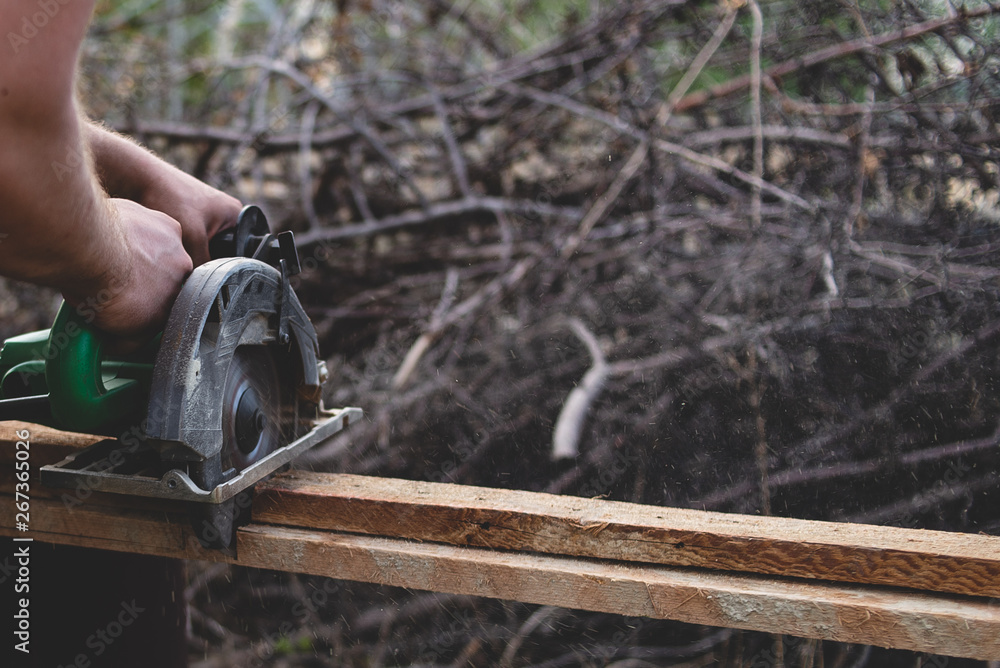 Naklejka premium man with chainsaw