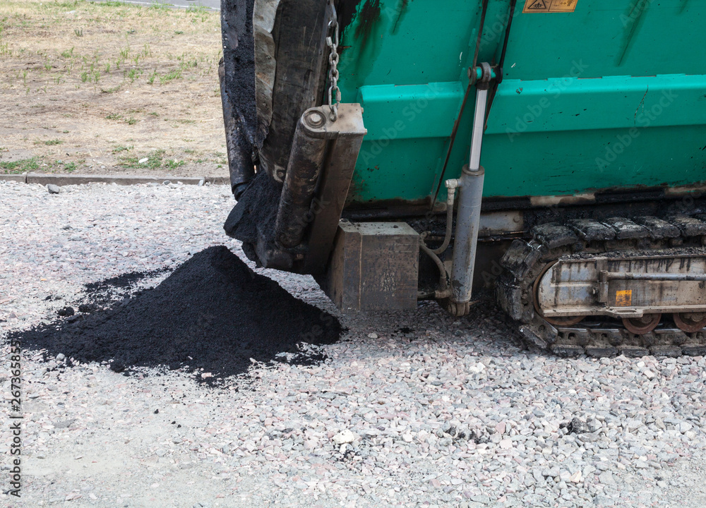 Paver working on the road construction Paver working on the road construction