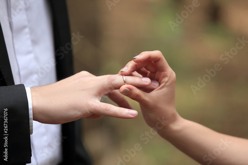 close, up., bride, putting, wedding, ring, grooms, finger.