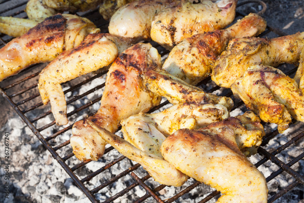 Chicken legs and wings on the grill