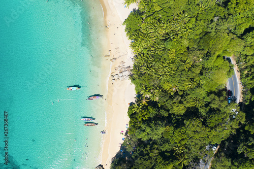 Obraz na płótnie View from above, stunning aerial view of a beautiful tropical beach with white sand and turquoise clear water, long tail boats and people sunbathing, Banana beach, Phuket, Thailand. w salonie