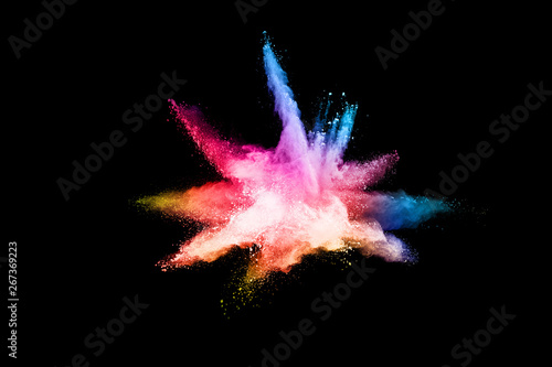 abstract colored dust explosion on a black background.abstract powder splatted background Freeze motion of color powder exploding throwing color powder  multicolored glitter texture.