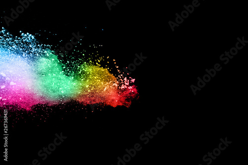 abstract colored dust explosion on a black background.abstract powder splatted background,Freeze motion of color powder exploding/throwing color powder, multicolored glitter texture.