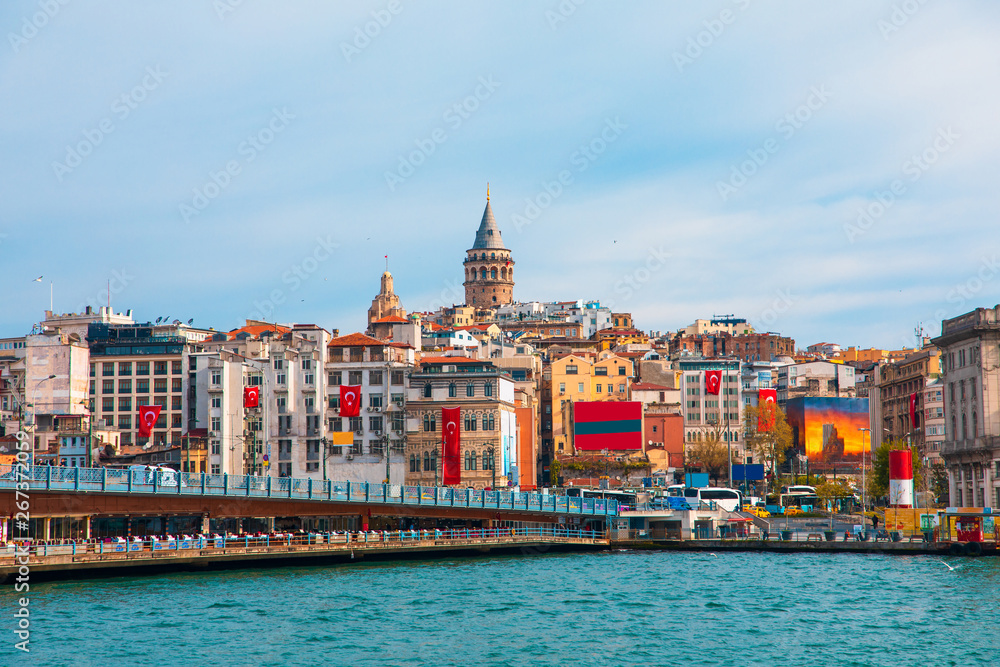 Naklejka premium Galata Tower in istanbul City of Turkey. View of the Istanbul City of Turkey with bosphorus, seagulls and boats.