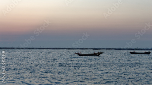 boat in sea at sunset