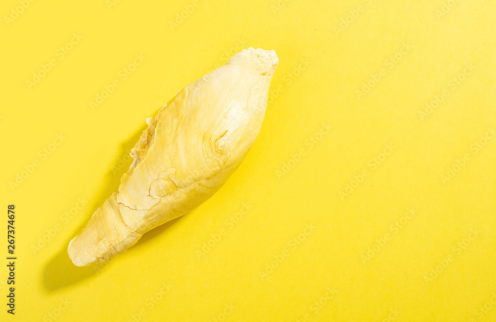Fresh delicious durian flesh on yellow background Fresh delicious durian flesh on yellow background