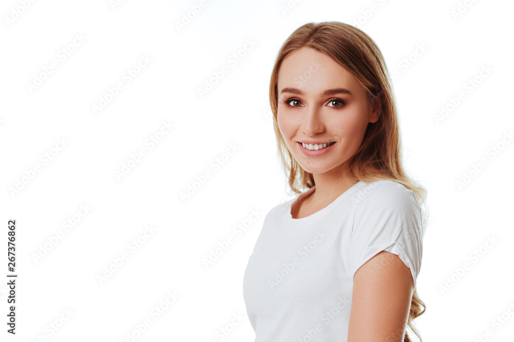 Young woman showing smile, in casual smart clothing, isolated against white background. Caucasian blonde model in emoshions and optimistic, positive, happy feeling concept studio shoot. Young woman showing smile, in casual smart clothing, isolated against white background. Caucasian blonde model in emoshions and optimistic, positive, happy feeling concept studio shoot.