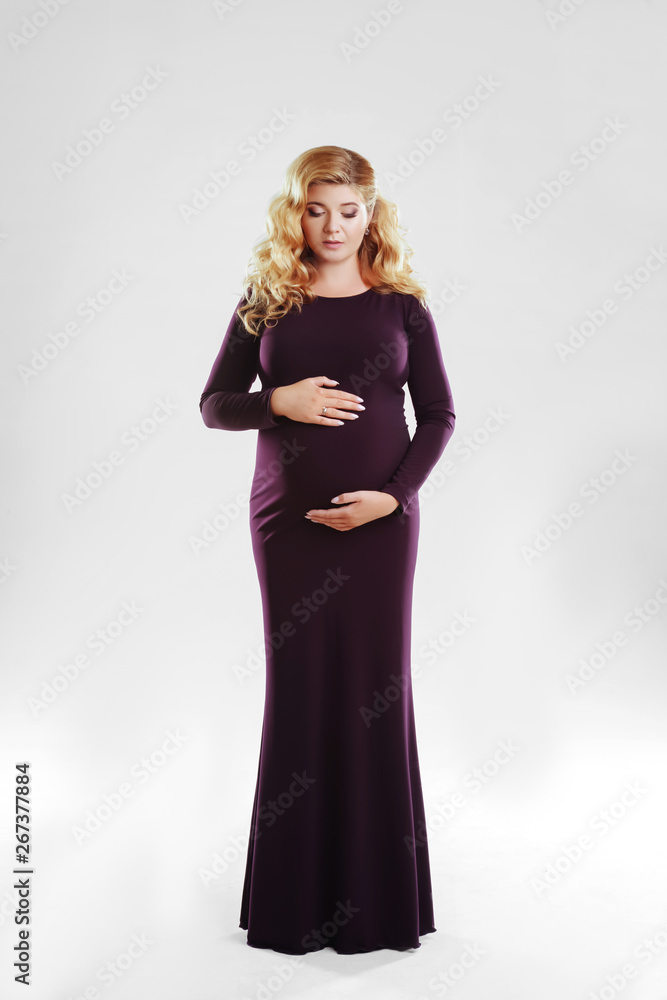 Beautiful pregnant woman in dark dress. studio shot Beautiful pregnant woman in dark dress. studio shot