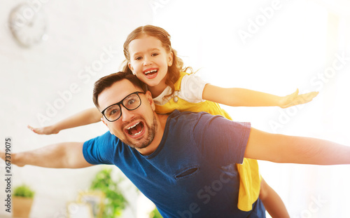 Father's day. Happy family daughter hugs his dad