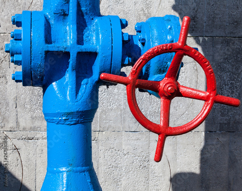 Red valve on the blue pipe.