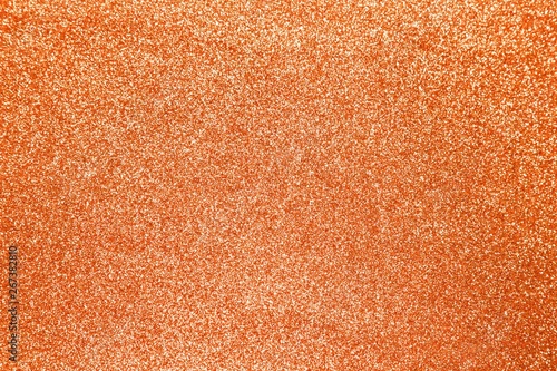 Orange glitter shiny texture background for christmas, Celebration concept.