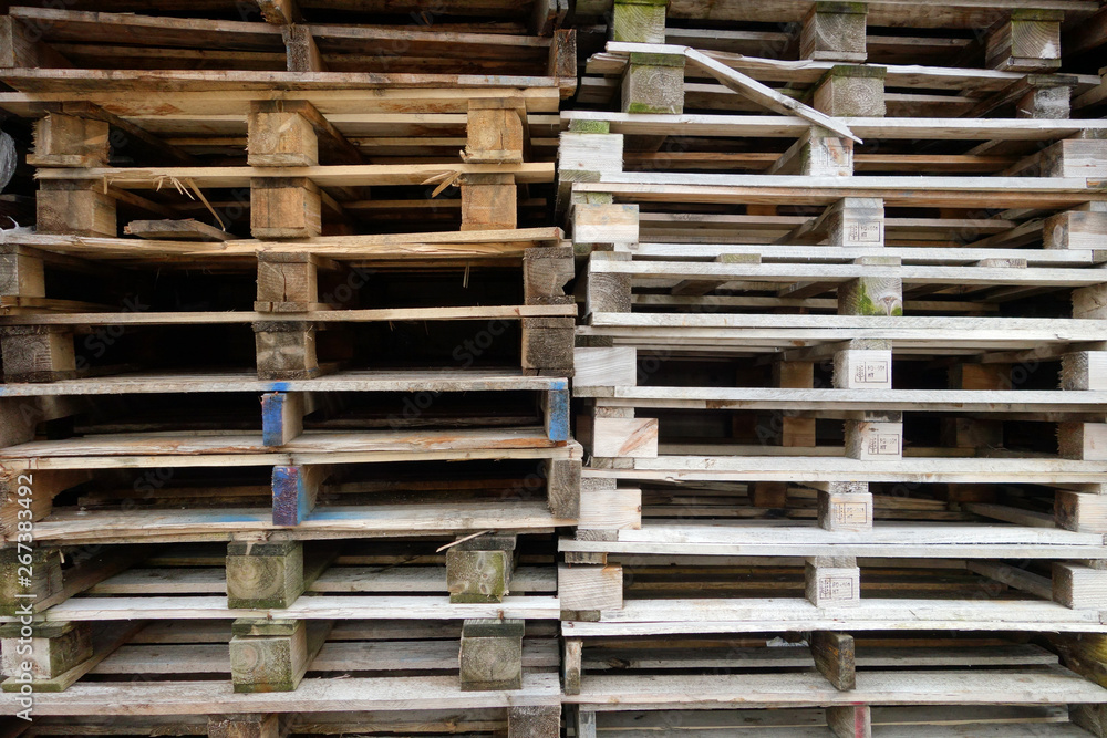 Stacks of old used discarded wooden shipping pallets Stacks of old used discarded wooden shipping pallets