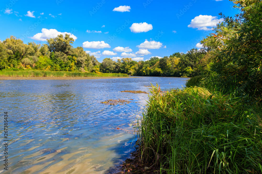 Summer landscape with beautiful river, green trees and blue sky Summer landscape with beautiful river, green trees and blue sky