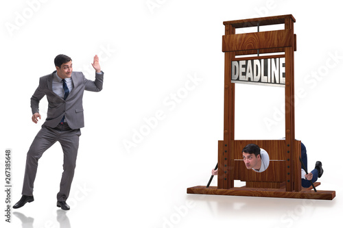 Businessman in deadline concept with guillotine photo