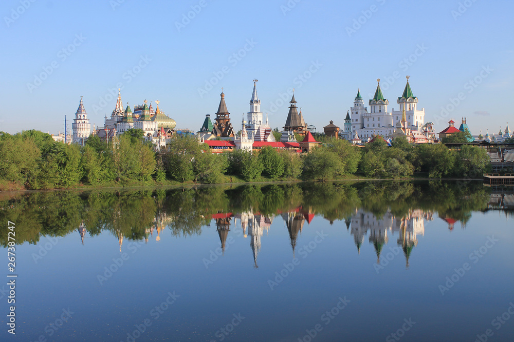 Kremlin in Izmailovo in Moscow Russia early spring morning with reflection in the blue water of the pond