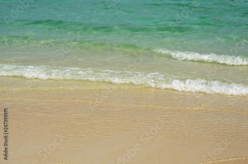 beautiful the beach closeup smooth sand and blue sea water. vacation background on summer in Thailand.
