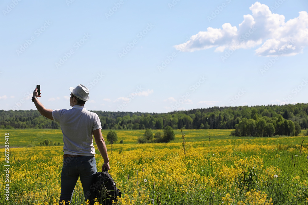 Young man travels with a backpack