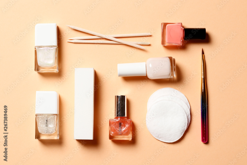 A set of tools for manicure and nail polish on a pink background A set of tools for manicure and nail polish on a pink background