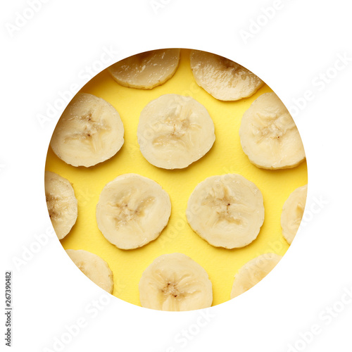 Creative summer pattern made of bananas slice on pastel yellow background. with frame . Fruit minimal concept. Flat lay.
