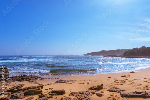 Ocean landscape wit beach and soft waves