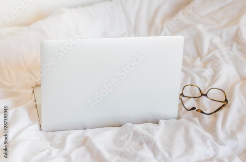 Laptop on a bed