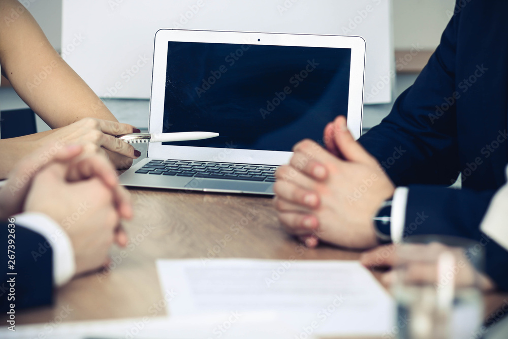Group of business people or lawyers at meeting, hands close-up Group of business people or lawyers at meeting, hands close-up