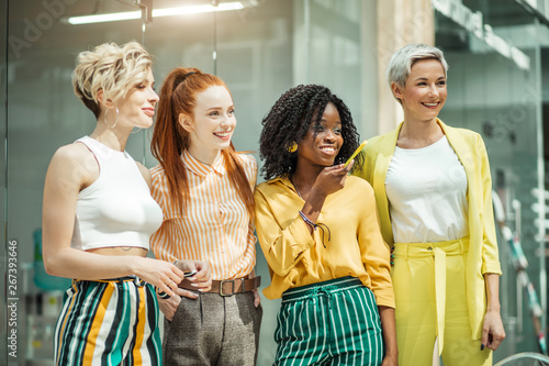 Obraz na plátně Mixed race happy talented successful businesswomen looking to the future