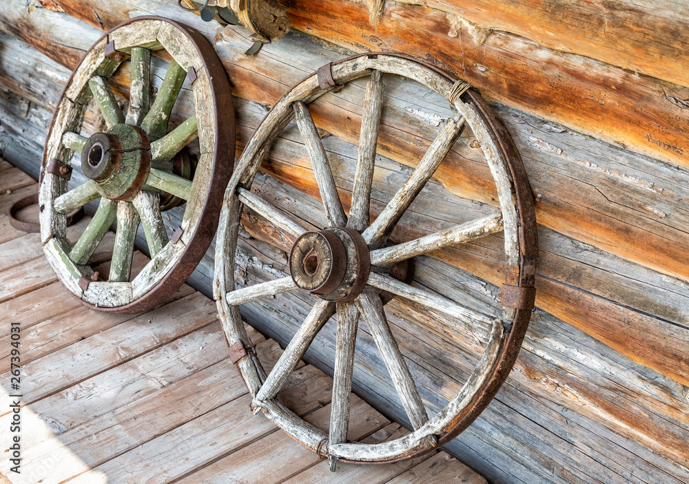 Old wooden broken wagon wheels
