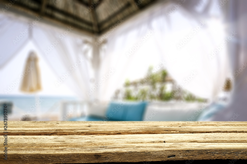 Table background of free space and beach lodge window 