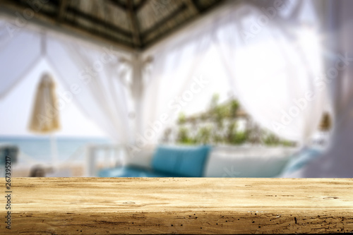 Table background of free space and beach lodge window  © magdal3na