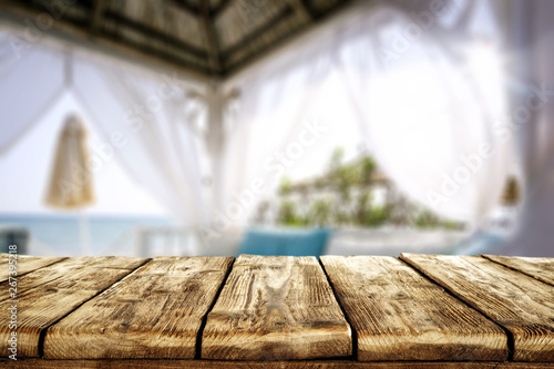 Table background of free space and beach lodge window  © magdal3na