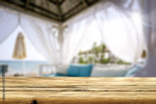 Table background of free space and beach lodge window  © magdal3na