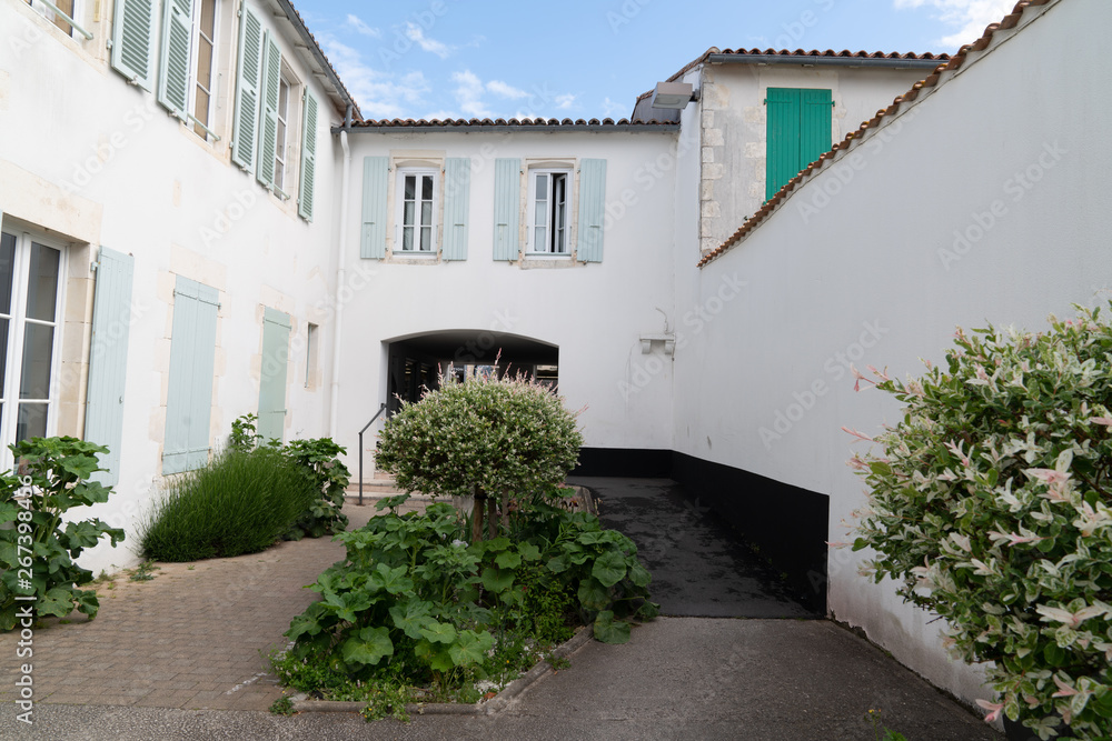 white house street in Re island village situated on Ile de Re, France