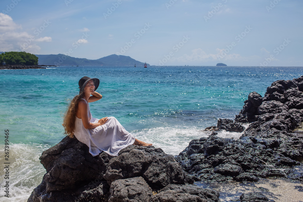 Happy woman in white dress on tropical beach vacation Happy woman in white dress on tropical beach vacation