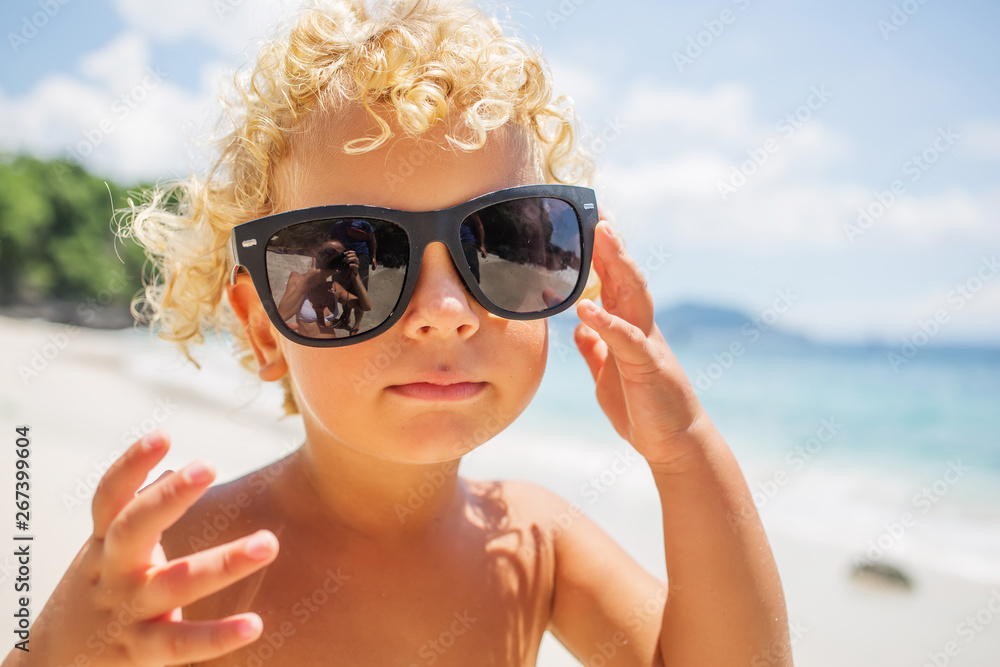 boy are playing on the beach boy are playing on the beach