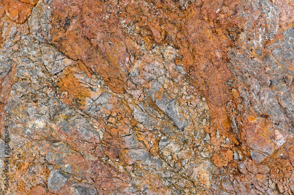 Rock texture and surface background. Cracked and weathered natural stone background.