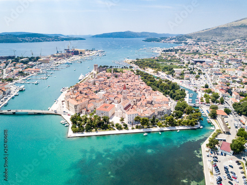 Aerial view of touristic old Trogir, historic town on a small island and harbour on the Adriatic coast in Split-Dalmatia County, Croatia. Ciovski most connects Ciovo and Trogir islands. Kastela gulf