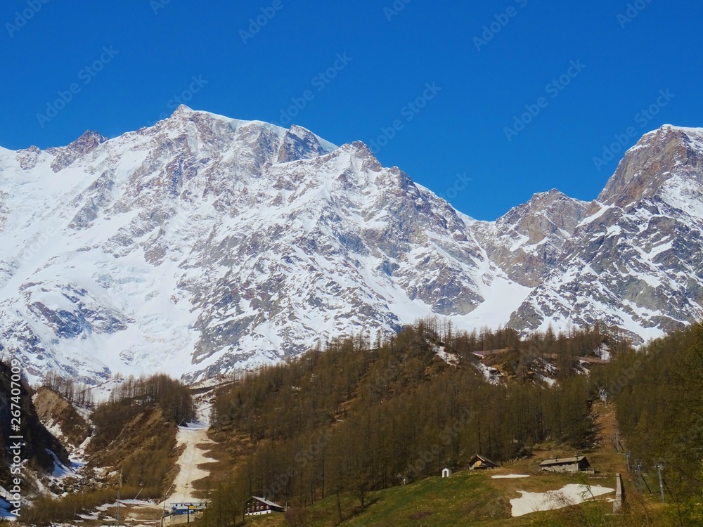 View of Monte Rosa on a sunny day near the village of Macugnaga, Italy - April 2019